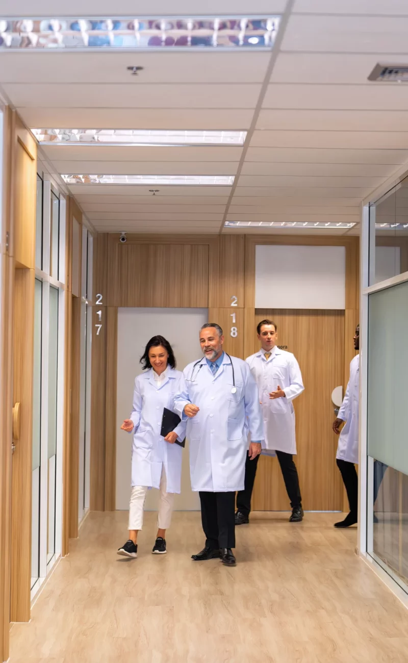 A team of doctors walking through the corridor at Eastgardens Medical Centre