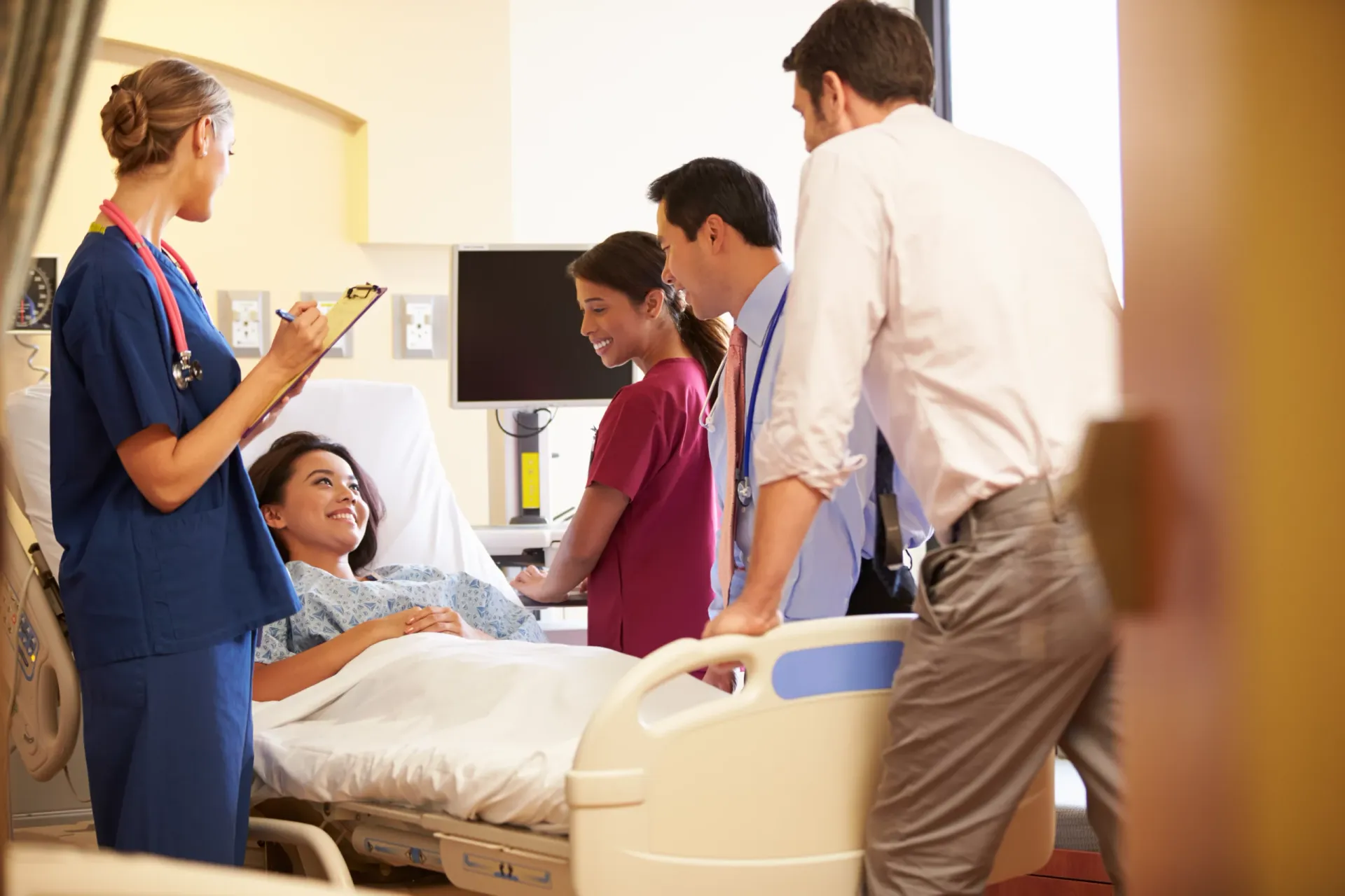 A medical team meeting around a patient at Eastgardens Medical Centre